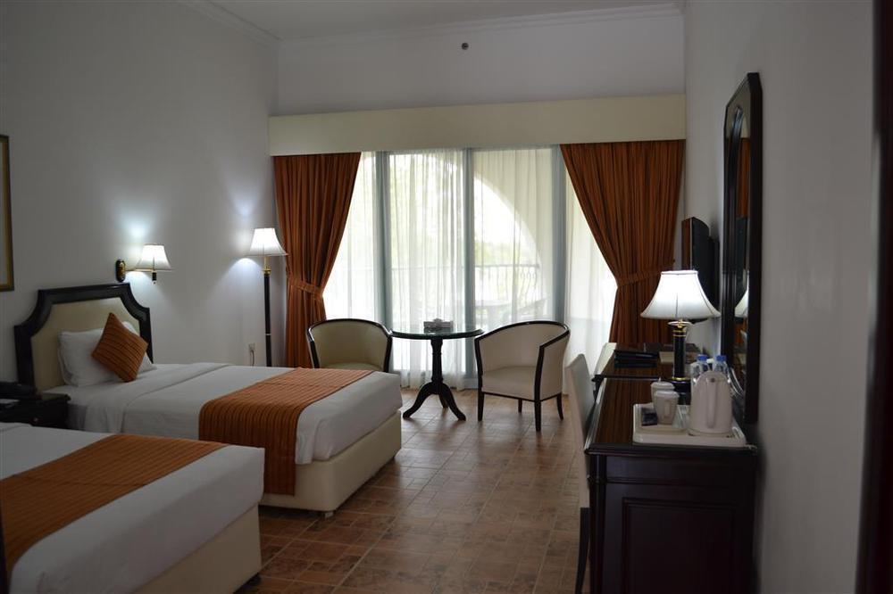 Tulip Inn Al Rahba Абу-Дабі Номер фото